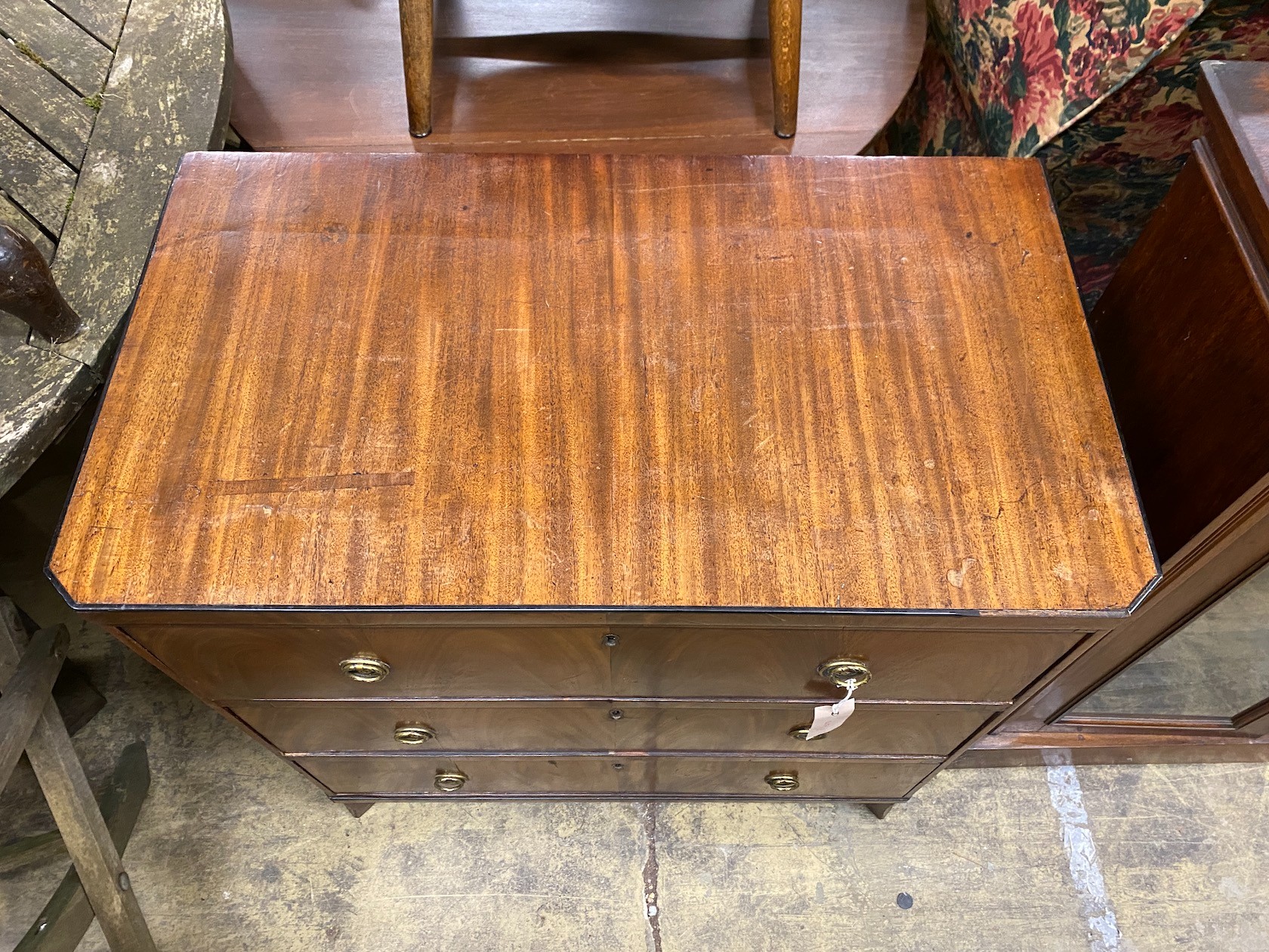 A small 19th century Continental mahogany three drawer chest, width 76cm, depth 43cm, height 78cm